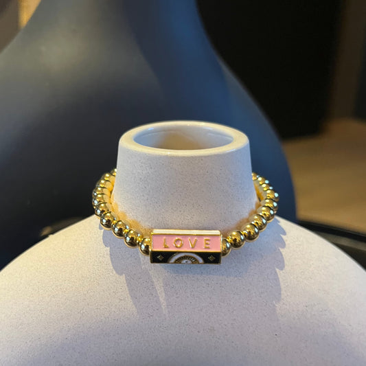 Bracelet Love porte-bonheur en perles dorées 